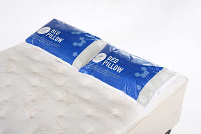 Queen pillows packaged on queen